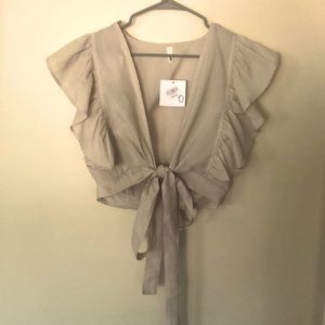 Tan/cream flutter sleeve tie top. Size M. Bought from boutique for $36.